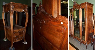 Lot 1359 - A French walnut three piece bedroom suite, comprising triple wardrobe, marble top bedside...