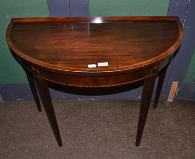 Lot 1393 - A George III mahogany demi lune side table