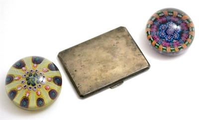 Lot 4 - Two glass paperweights and a silver cigarette case