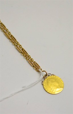 Lot 16 - A spade Guinea, dated 1791, soldered as a pendant and a fancy link chain, length 37cm