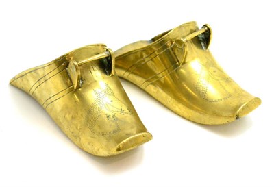 Lot 83 - A pair of brass stirrups engraved with horse's heads