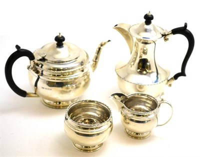 Lot 96 - A silver four piece tea set