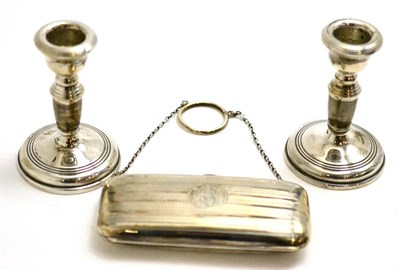 Lot 109 - A pair of small silver candlesticks together with a silver purse
