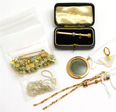 Lot 143 - A small group of jewellery, including a locket, of circular form with a glass fronted aperture...
