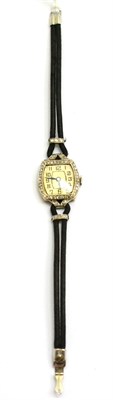 Lot 144 - A lady's diamond set tonneau shaped wristwatch