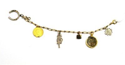 Lot 158 - A charm bracelet, hung with assorted charms including a horseshoe, coins and a stone set imp (a.f.)