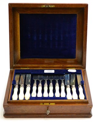 Lot 199 - A part set of eighteen silver and mother-of-pearl fruit knives and forks, cased (one fork missing)