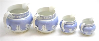 Lot 202 - A set of four Newhall lilac and white graduated jugs, pattern number U173