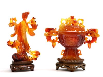 Lot 210 - Two boxed pieces of agate coloured glass comprising a covered urn and a figure