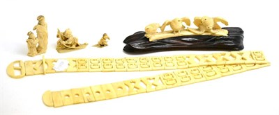 Lot 235 - A group of early 20th century ivory including an elephant carved belt, three Japanese figures and a