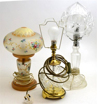 Lot 329 - A Waterford Crystal Kent Accent table lamp, a cut glass mushroom lamp and an enamelled lamp,...