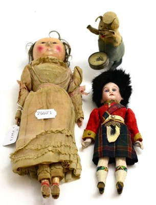 Lot 331 - 19th century carved wooden doll with brown eyes, painted face on a wooden body, leather hands, in a