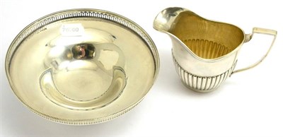 Lot 383 - A silver footed bowl together with a silver helmet form cream jug