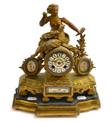 Lot 404 - A 19th century French gilt metal and porcelain mantel clock, on a plinth