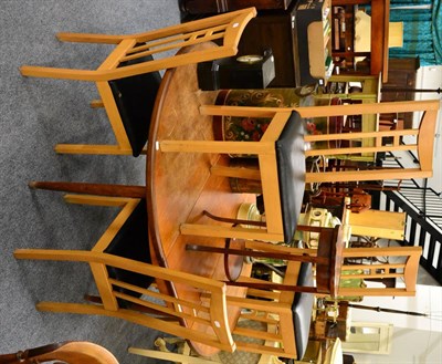 Lot 1060 - A circular extending table, a mahogany plant stand and six chairs