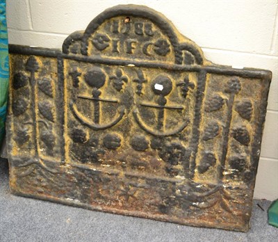 Lot 1090 - A large cast fireback, depicting anchors