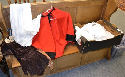 Lot 1114 - Assorted children's white cotton dress, brown velvet coat dress, red cape, day and night...