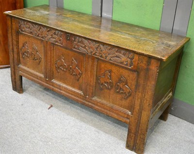 Lot 1220 - A carved oak coffer