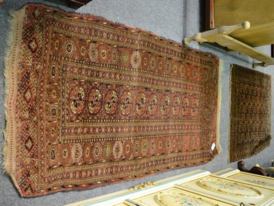 Lot 1226 - Tekke rug, Emirate of Bukhara, the field with a column of quartered guls enclosed by sun burst...