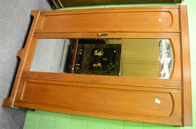 Lot 1230 - An oak mirror door wardrobe