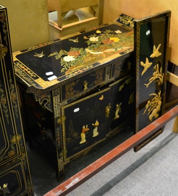 Lot 1239 - Chinoiserie lacquered low table fitted with drawers and cupboard doors, together with a...