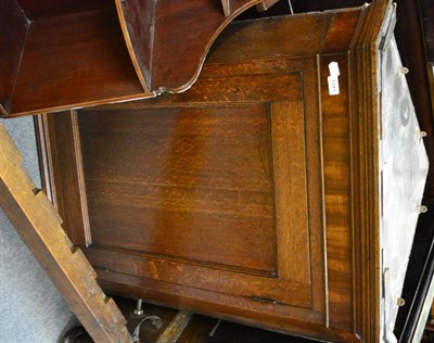 Lot 1243 - George III oak hanging corner cupboard with panelled door