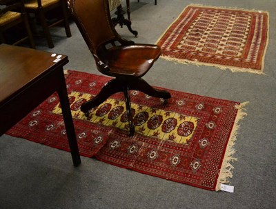 Lot 1270 - A Pakistani Bukhara rug, Lahore, Punjab, the pale camel ground with three columns of quartered guls