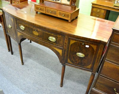 Lot 1276 - A George III string inlaid mahogany bow fronted sideboard, the drawers inlaid with shell marquetry