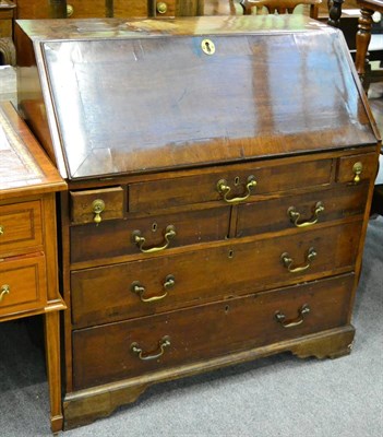 Lot 1299 - A Georgian crossbanded walnut bureau