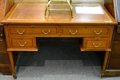 Lot 1300 - Waring & Gillow writing table with four drawers