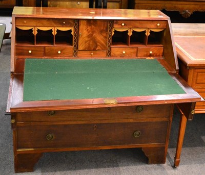 Lot 1302 - George III string inlaid mahogany bureau