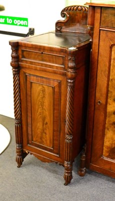 Lot 1348 - A 19th century mahogany cabinet, the top inset with a leather writing surface on an easel stand