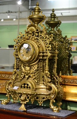 Lot 1359 - A 20th century brass three piece clock garniture