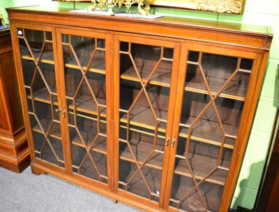 Lot 1362 - An astragal glazed four door mahogany bookcase