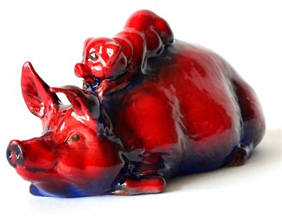 Lot 113 - Royal Doulton Flambe 'Pigs, Snoozing', one pig with ears down, one with ears up, model No.62