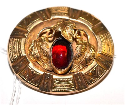 Lot 128 - A Victorian garnet set brooch