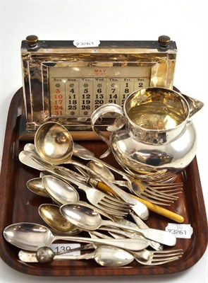 Lot 139 - Silver jug, silver mounted desk calendar and miscellaneous silver flatware