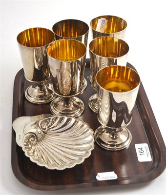 Lot 164 - A set of six silver goblets and a silver shell dish