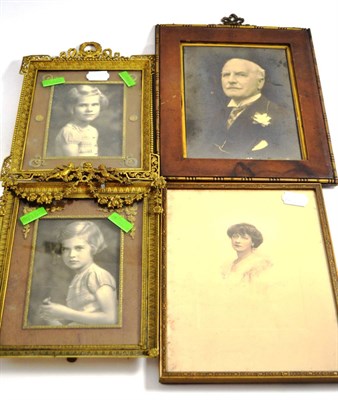 Lot 166 - Two ormolu strut photograph frames and three family photographs including a portrait of Lord...