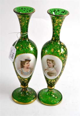 Lot 199 - A pair of Bohemian green glass vases relief decorated with oval portraits, 26.5cm high