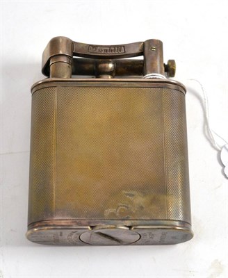 Lot 207 - Dunhill table lighter in a silver plated engine turned case, patent no 390107