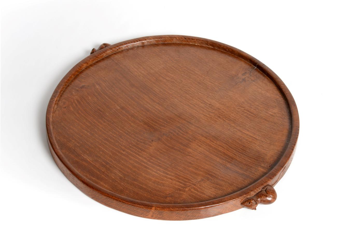 Lot 672 - Mouseman: A Robert Thompson English Oak Circular Tea Tray, with raised edge and two carved mice...