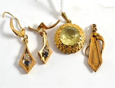 Lot 225 - A 9ct gold citrine pendant, a pair of earrings and a single earring