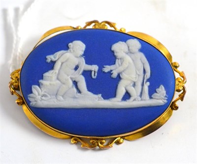 Lot 227 - A Wedgwood brooch in decorative frame