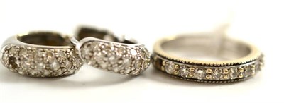 Lot 258 - A pair of diamond cuff earrings (one stone missing) and a diamond half hoop ring (one stone...