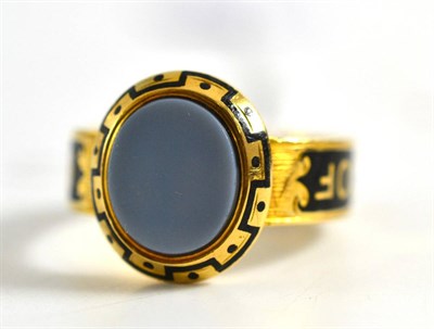 Lot 260 - An 18ct gold mourning ring, an oval agate with black enamelled detail, finger size R