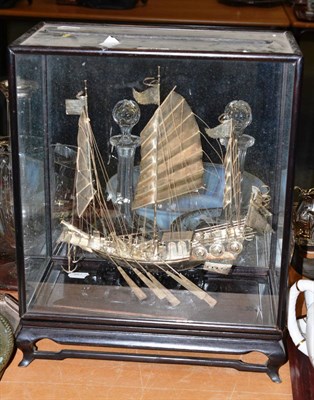 Lot 285 - A Chinese export white metal model of a junk, with a presentation case