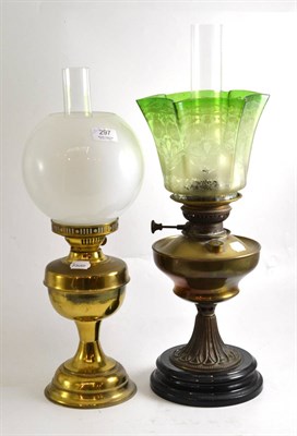 Lot 297 - Two gilt metal oil lamps, one with a Victorian green acid etched shade, the other with an...