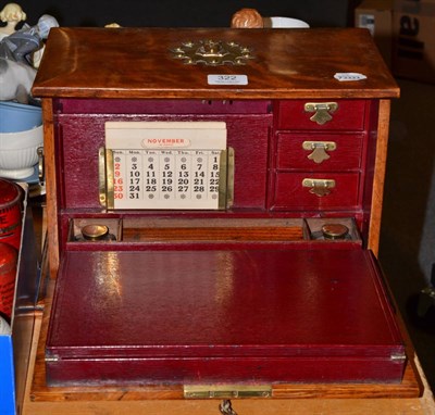 Lot 322 - A Victorian oak fall front stationary chest