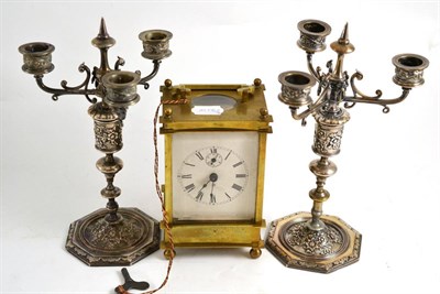 Lot 343 - Brass cased carriage clock and a pair of Continental plated candelabra